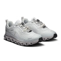 A pair of On running shoes in light gray and white, featuring a chunky segmented sole and a circular logo on the side and tongue, set against a plain white background.