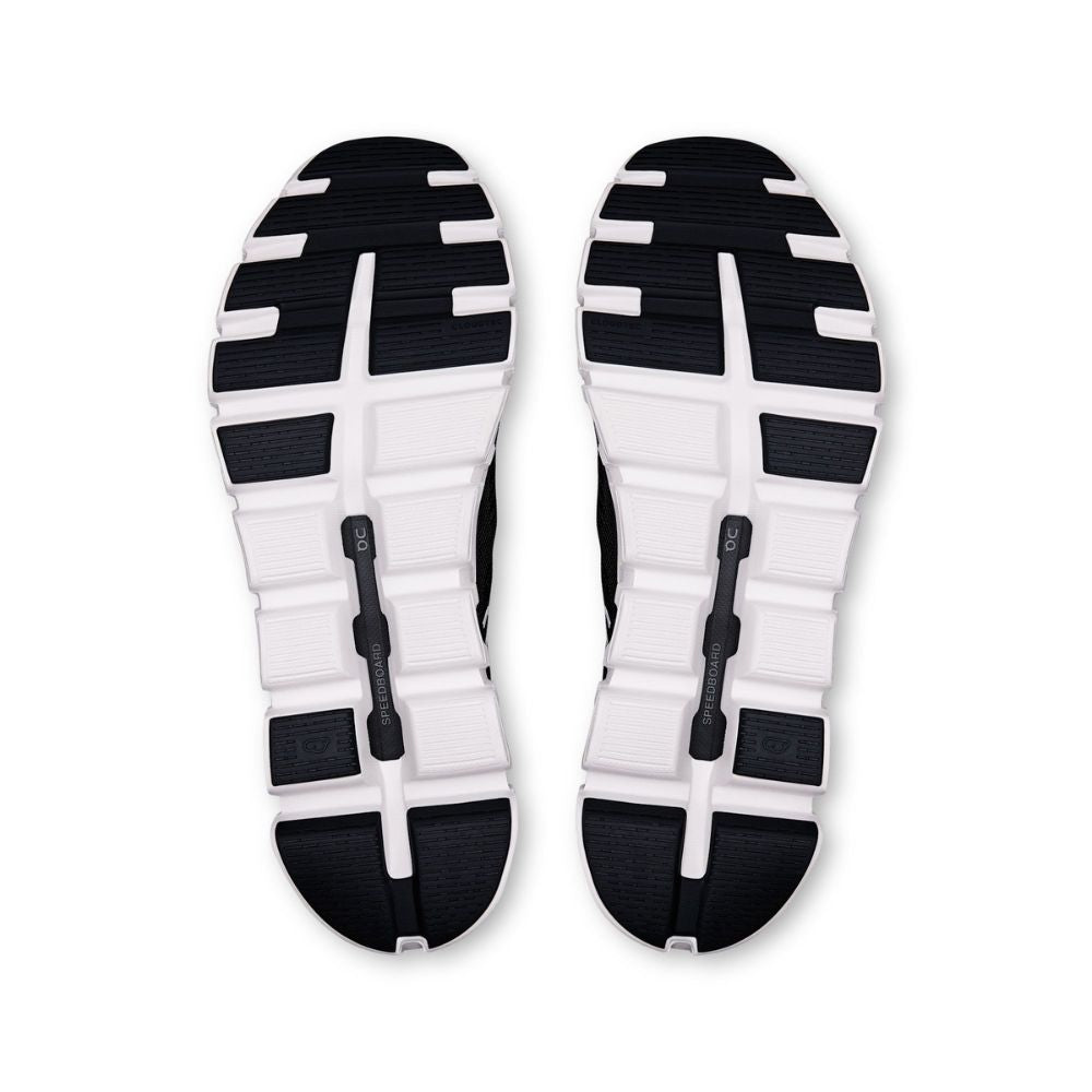 A pair of athletic shoes shown from the sole view, featuring a black and white treaded outsole design on a plain white background.