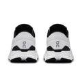 A pair of white and black running shoes shown from the back, featuring a white mesh upper, black collar lining, and a black and white chunky sole with a gray 'on' logo.