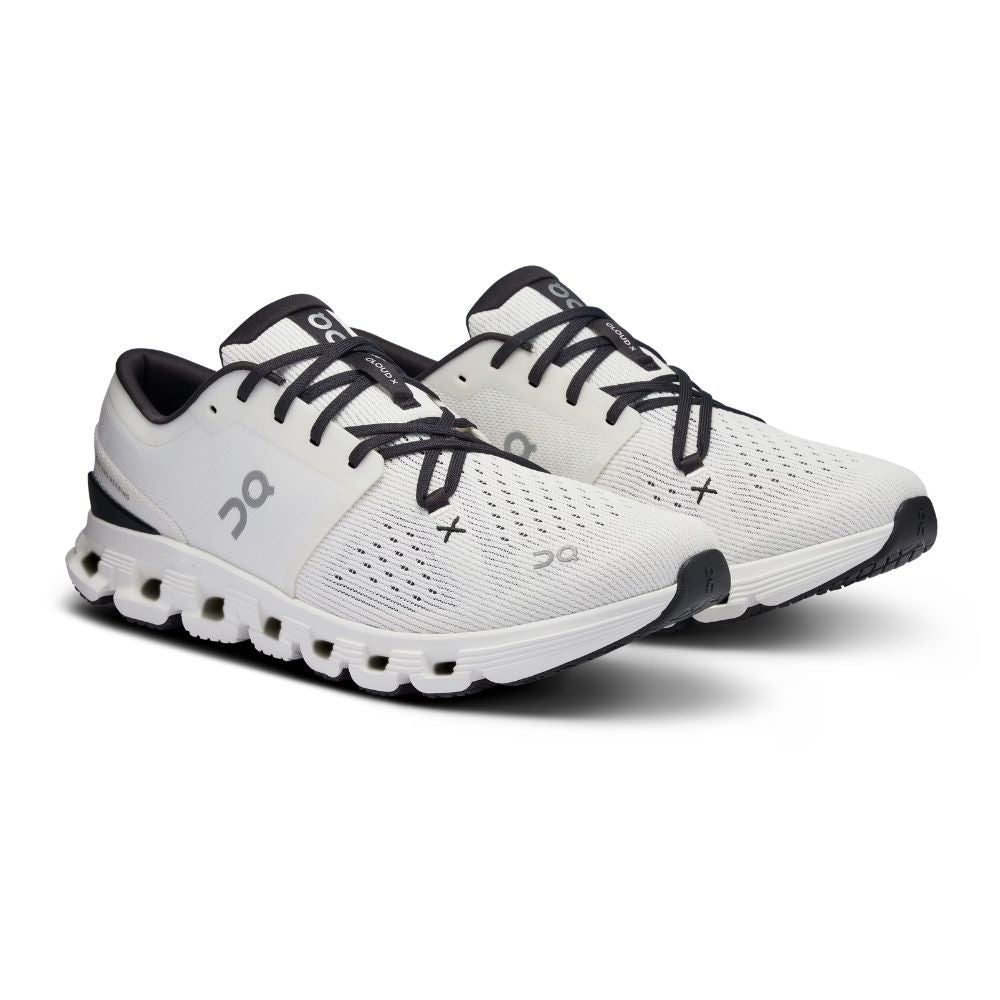 A white On Cloudrunner sneaker with black laces, a black heel accent, and a gray On logo on the side, shown in a side profile against a white background.