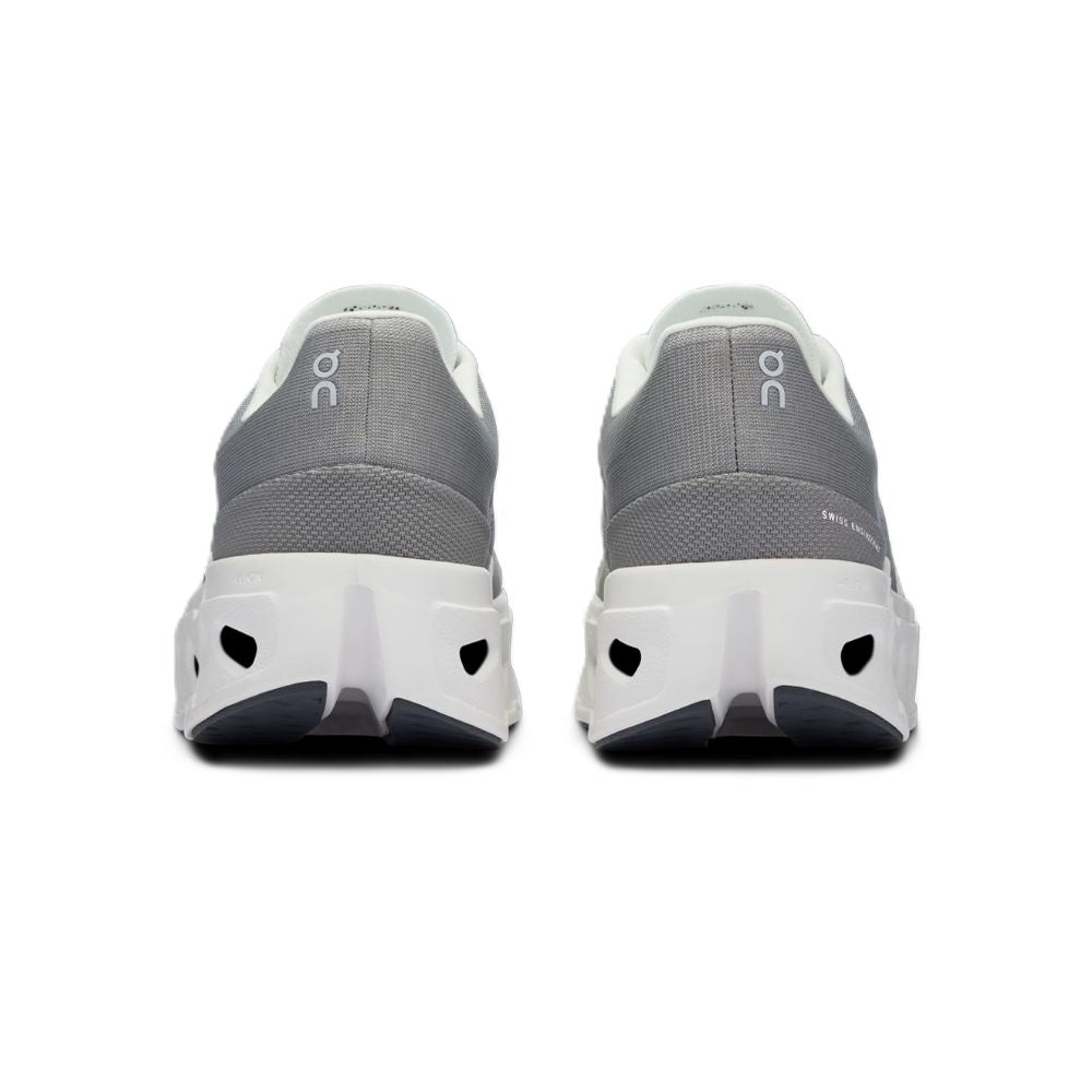A pair of gray and white running shoes shown from the back, featuring a textured gray upper, white midsoles, and a dark gray outsole, with the 'on' logo visible on the heel.