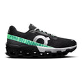 A black On Cloudrunner sneaker with a distinctive green and white 'ON RUNNING' logo on the side, featuring a chunky black cloud-like sole and white laces, shown against a plain white background.