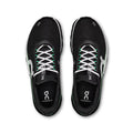 A pair of black On running shoes with white laces and green accents, shown from a top-down view on a white background.
