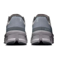 A pair of gray On running shoes shown from the rear, featuring the On logo on the heel and a chunky gray and black sole, set against a plain white background.