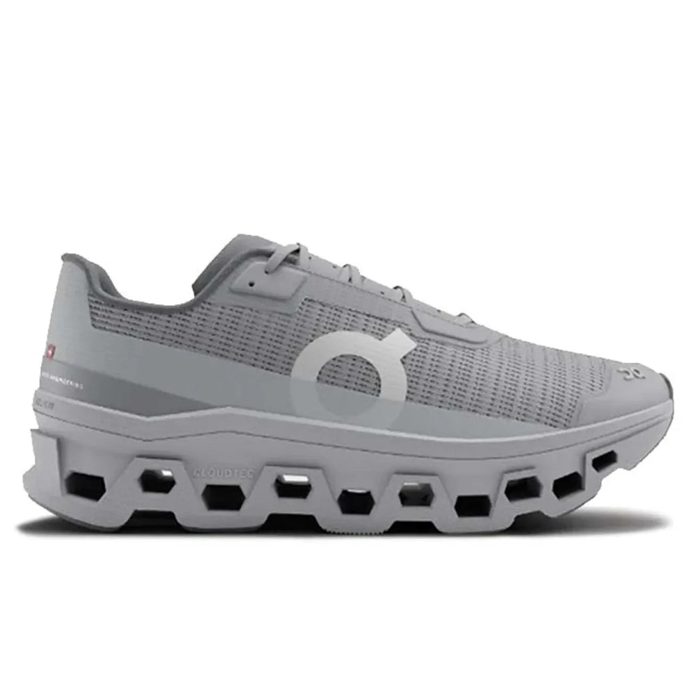 Pink running shoe with white sole on a light gray background