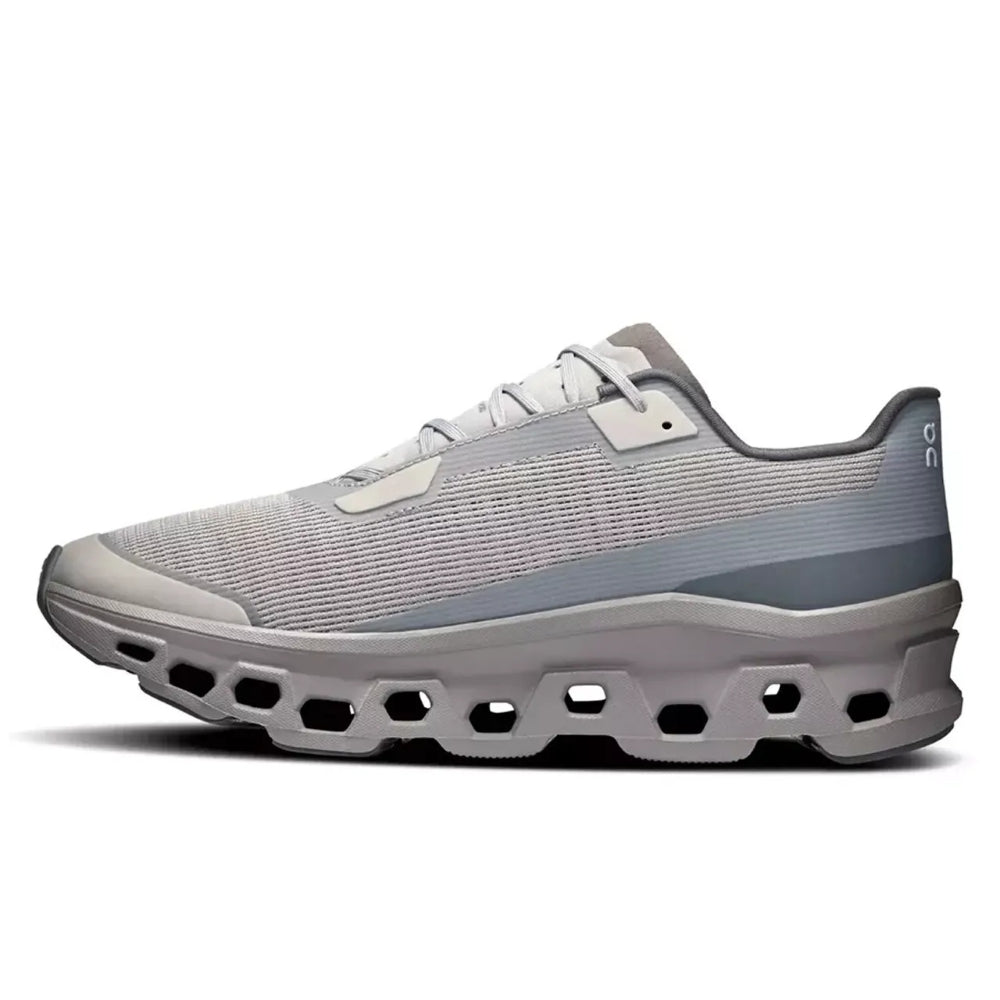 A light gray and white athletic sneaker with a distinctive hollowed-out sole, shown in a side profile on a white background.