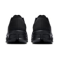A pair of black athletic sneakers shown from the rear, featuring textured upper panels and chunky black soles, set against a plain white background.