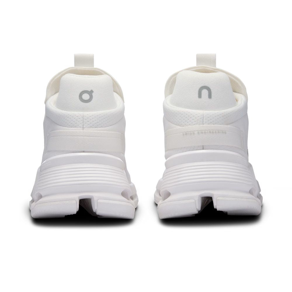 White athletic shoes with brand logo on a white background
