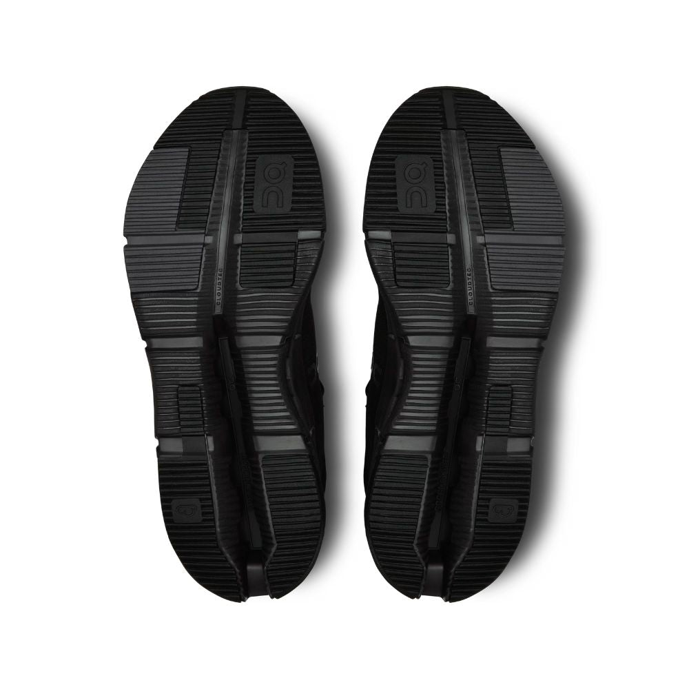 Black sandals with thick soles on a white background