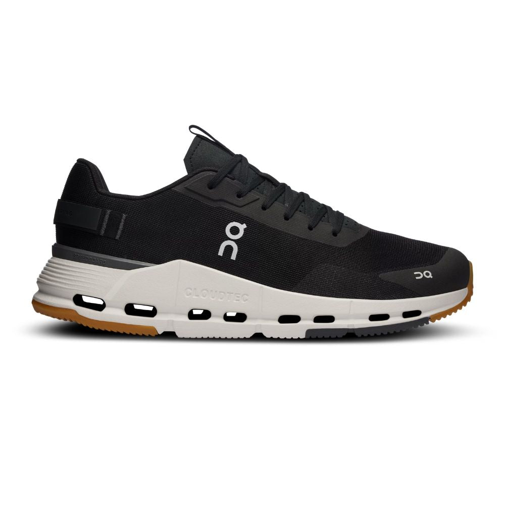 A black On running shoe with a white midsole and gum outsole, shown in a side profile on a white background.