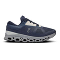 A navy blue On running shoe with a white and gray CloudTec sole, shown in a side profile on a white background.