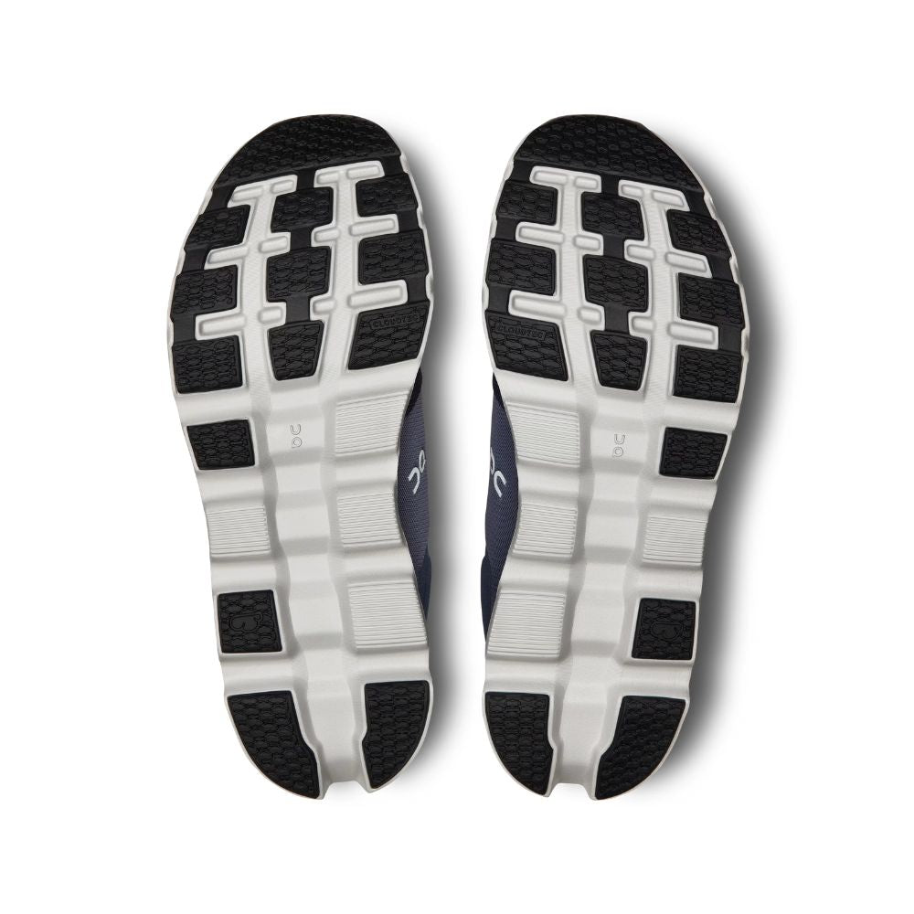 Close-up of a pair of black and white athletic shoes on a white background