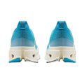A pair of athletic sneakers shown from the back, featuring a bright blue and teal knit upper, a translucent light blue heel section, and a chunky off-white midsole with a small blue accent at the outsole.