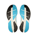A pair of athletic shoe soles shown from the bottom, featuring a color-blocked design with bright blue, black, and off-white sections.