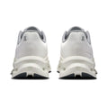 A pair of white and gray athletic sneakers shown from the back, featuring chunky sculpted midsoles and a small gray logo on the heel.