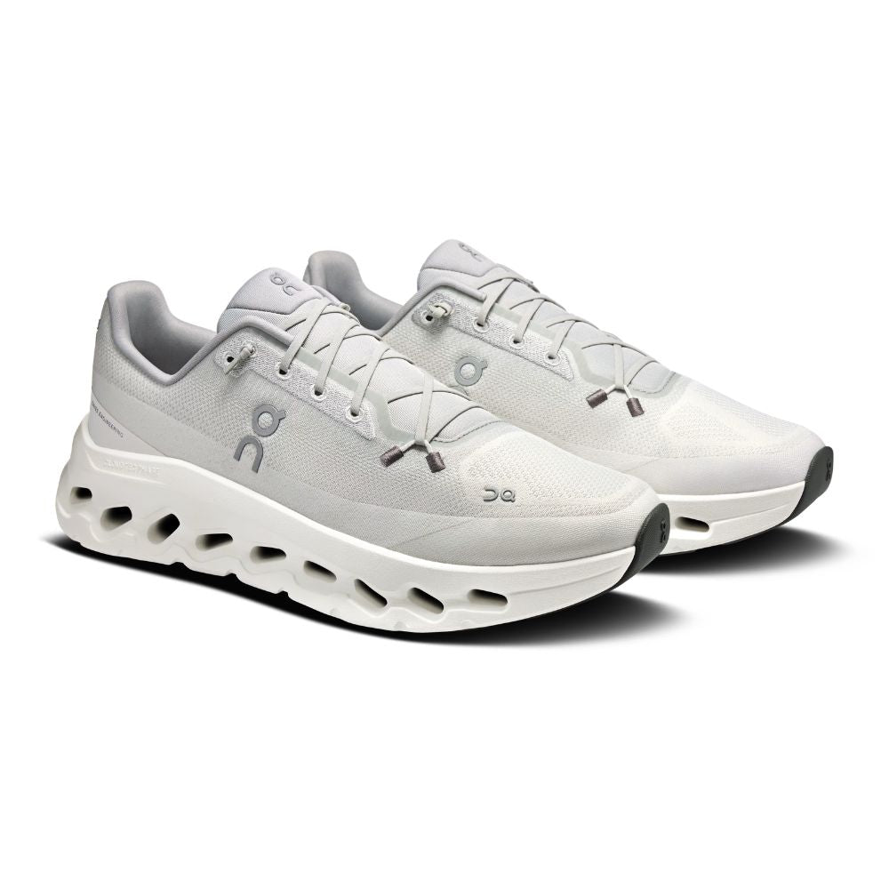 A white On running shoe with a chunky, sculpted white midsole featuring black cutout details, shown in a side profile on a white background.
