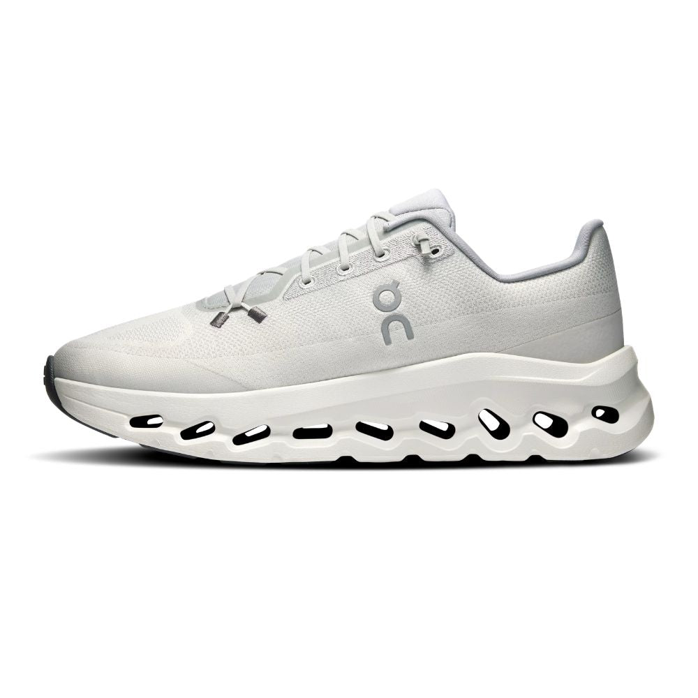 A white On running shoe with a chunky, sculpted white midsole featuring black cutout details, shown in a side profile on a white background.