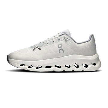 A white On running shoe with a chunky, sculpted white midsole featuring black cutout details, shown in a side profile on a white background.