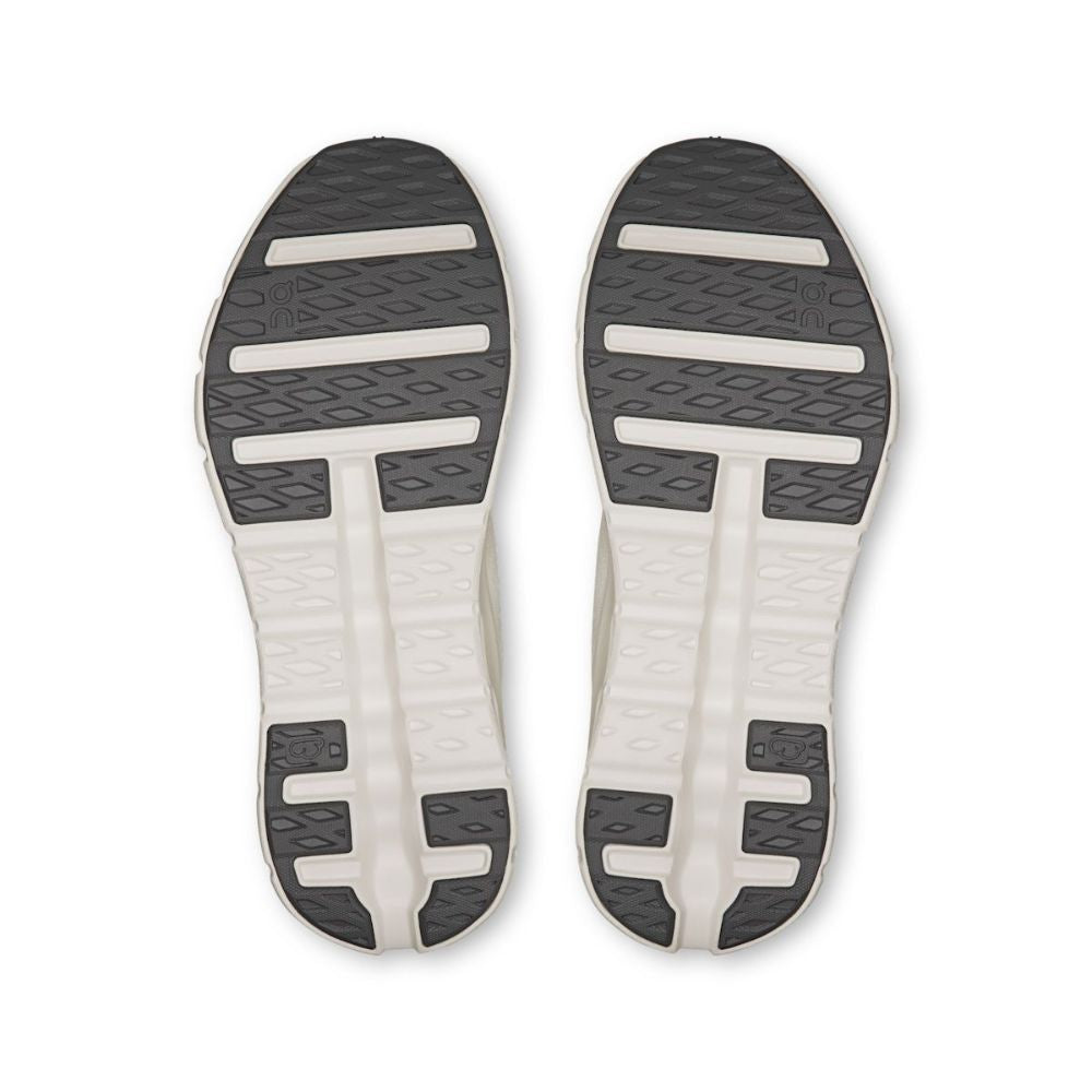 Top view of a pair of shoes with a white sole and black tread pattern on a white background