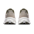 A pair of On running shoes shown from the back, featuring a light taupe knit upper, olive green collar details, and a chunky white midsole with dark gray outsole accents.