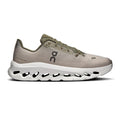 Beige running shoe with white sole on a white background