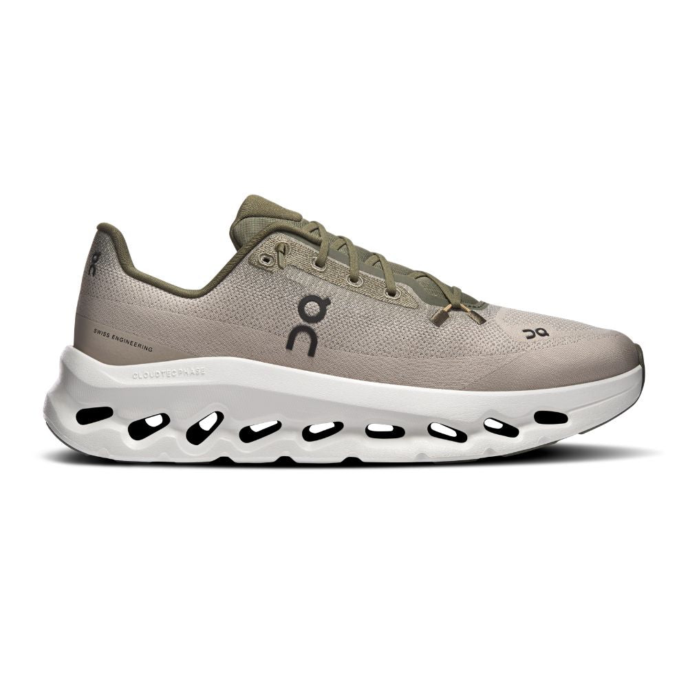 Beige running shoe with white sole on a white background
