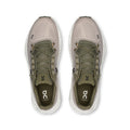Pair of gray running shoes with white soles on a white background