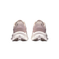 A pair of chunky platform sneakers shown from the back, featuring a dusty pink textured upper and a thick white sole, set against a plain white background.