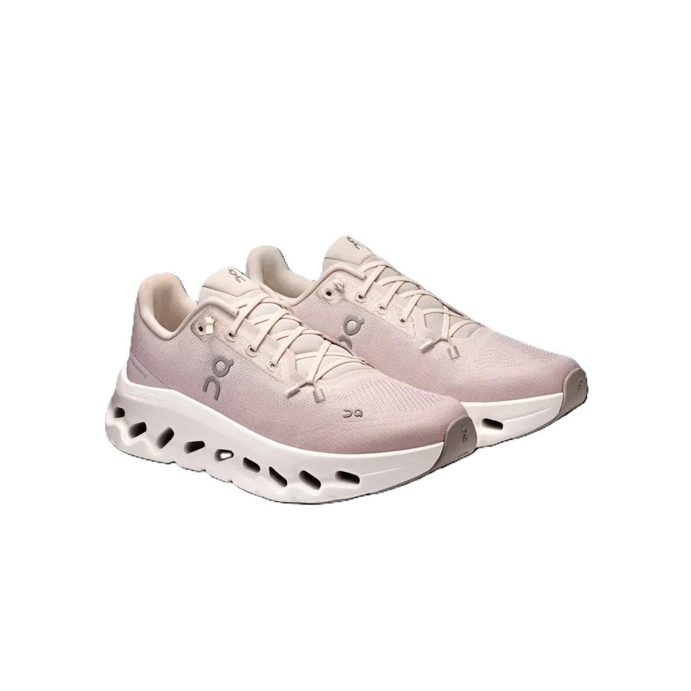A pair of light pink running shoes with white midsoles and gray accents, displayed on a clean white background.