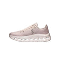 A single light pink and white athletic sneaker shown in a side profile on a solid white background. The shoe features a textured pink upper, matching pink laces, a white midsole with circular cutouts, and a small gray 'on' logo on the side.