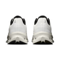 A pair of white On running shoes shown from the back, featuring black accents on the collar, tongue, and outsole, with the On logo visible on the heel.