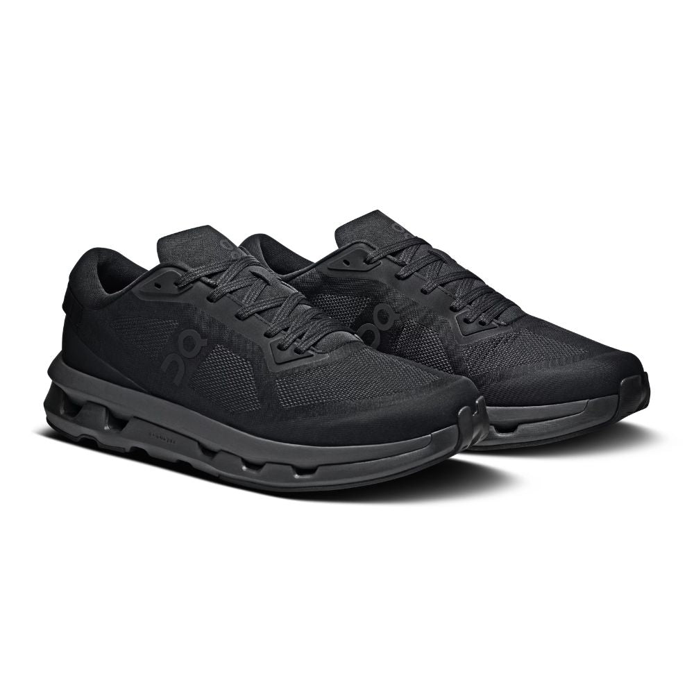 A pair of black athletic sneakers with a matching black sole, shown from a three-quarters angle on a white background.