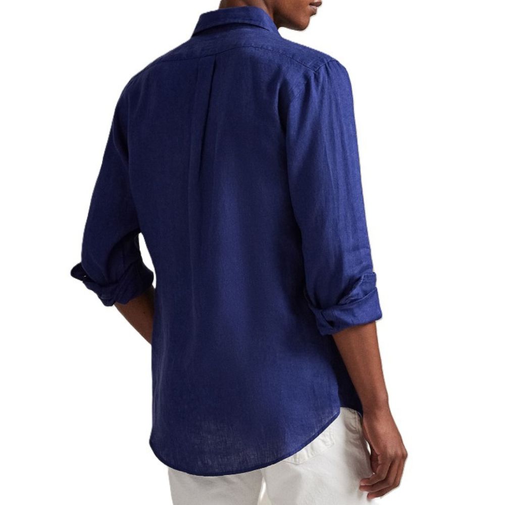 A man wearing a navy blue long-sleeve linen shirt with rolled-up sleeves, shown from the back against a white background.