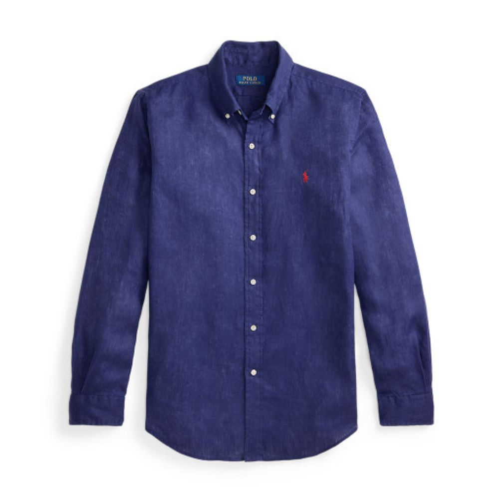 A long-sleeve button-down shirt in a textured indigo blue fabric, featuring a small embroidered red polo player logo on the left chest. The shirt is displayed flat against a clean white background.