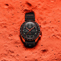 Omega watch on a red textured surface