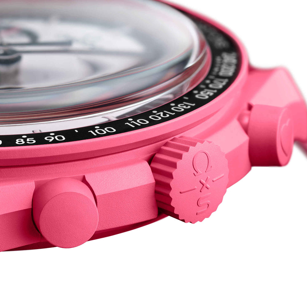 Pink Omega x Swatch Swatchmaster wristwatch with a pink rubber strap, black bezel, and white dial with black subdials.