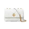 A white quilted leather handbag with a gold-tone cross logo on the front, gold studs, and a gold chain strap, shown against a plain white background.