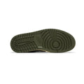 The outsole of a Nike shoe in olive green, showing the tread pattern and embossed Nike Swoosh, photographed on a white background.
