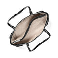 An overhead view of a black leather handbag showing its spacious interior with a beige quilted pattern lining and silver-tone hardware.