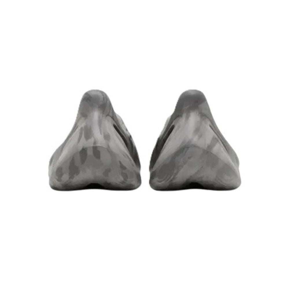 Two gray marble-like shoes on a white background